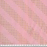 Tissu graphique doré fond rose 100% coton