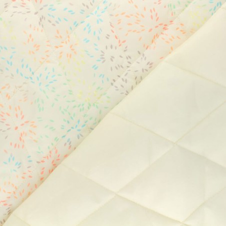 Tissu doudoune matelassé feux d'artifice fond écru