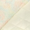 Tissu doudoune matelassé feux d'artifice fond écru