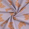 Tissu French Terry croissants fond lilas Tissu French Terry croissants fond lilas