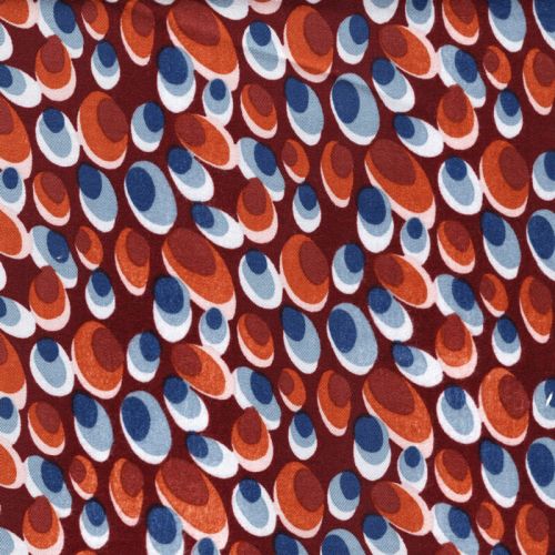 Tissu viscose twill stretch ovales fond terracotta