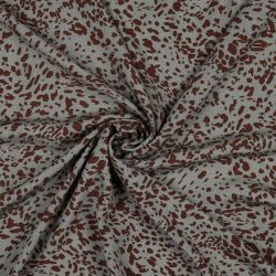 Tissu viscose jaguar fond vert mousse