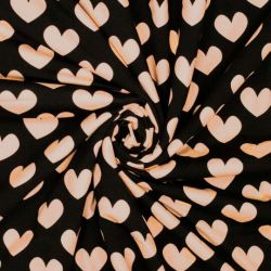 Tissu jersey coeur rose poudré fond noir