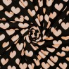 Tissu jersey coeur rose poudré fond noir Tissu jersey coeur rose poudré fond noir