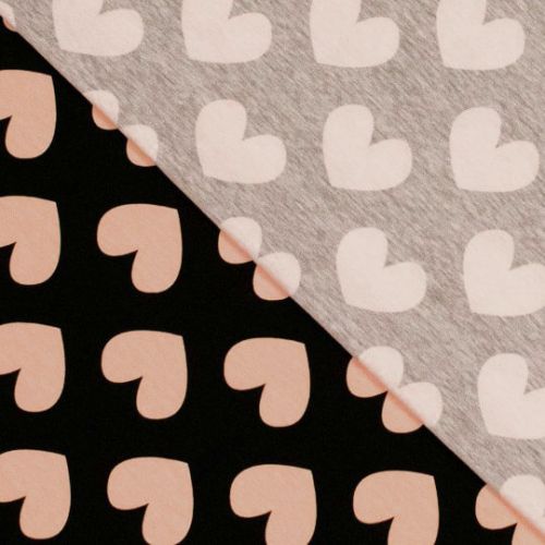 Tissu jersey coeur rose poudré fond noir