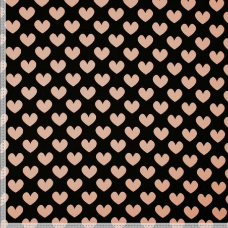 Tissu jersey coeur rose poudré fond noir