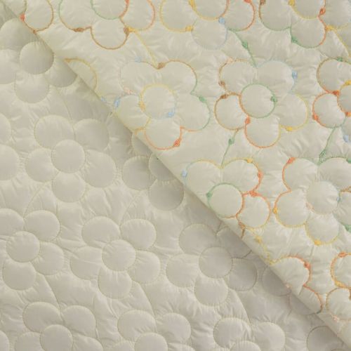 Tissu matelassé doudoune brodé fleur fond écru