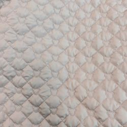 Tissu matelassé tête d'ours beige rosé